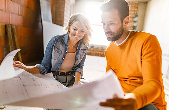 Couple reviewing plans for home renovation 