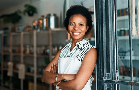 Woman in apron standing in store