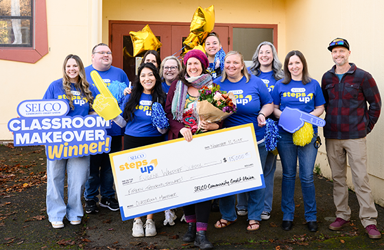 SELCO Steps Up Classroom Makeover winner announcement at Eugene Waldorf School, featuring community members and school supporters holding a $15,000 classroom makeover check and celebrating the 2026 classroom transformation project in Eugene, Oregon.