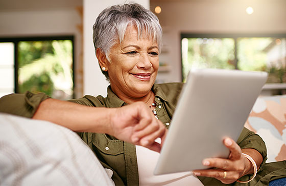 Women making an online payment using a tablet 