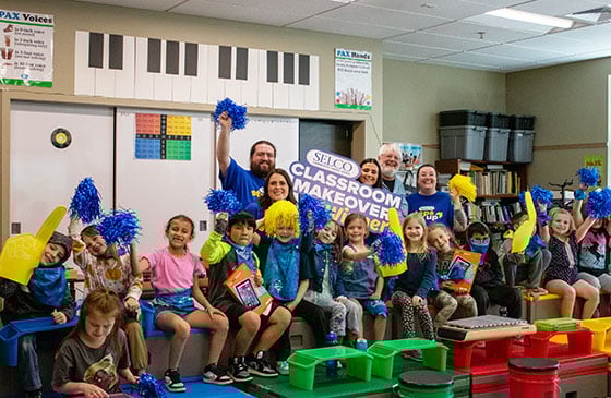 SELCO classroom makeover winner celebration in a classroom. 