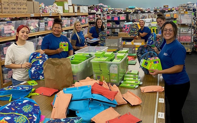 SELCO Community Credit Union team members working with Bags of Love