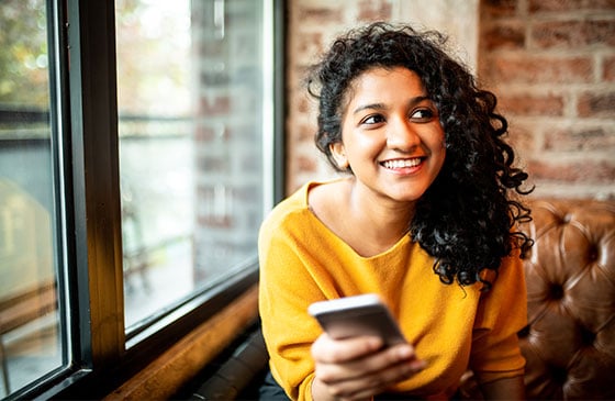 Person using phone to enroll in credit union eStatements 