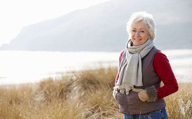 Mature woman standing near the ocean