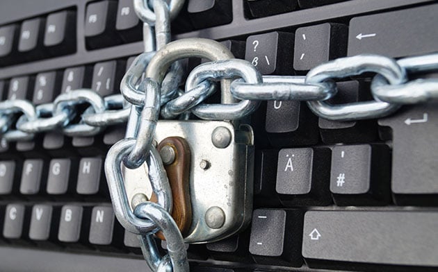 A padlock on a computer keyboard.