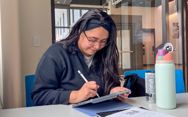 Giselle working on a tablet