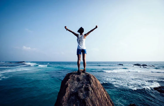 Person standing near the ocean