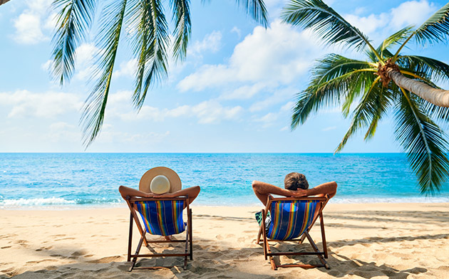 Two people relaxing at the beach