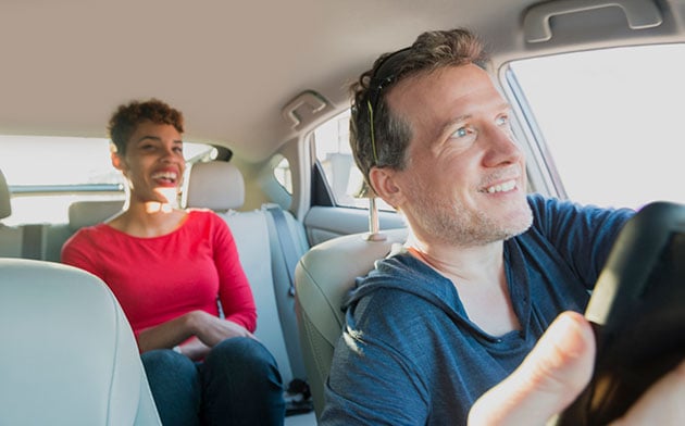 Driver and his client share a ride together. 