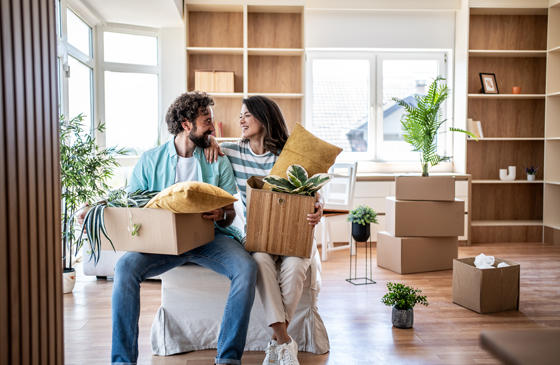 Couple taking a break while moving into new home