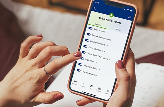 SELCO digital banking app showing subscription alert options.