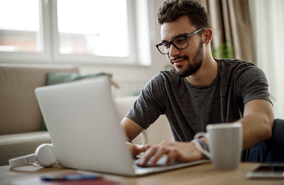 Man does research on his computer.