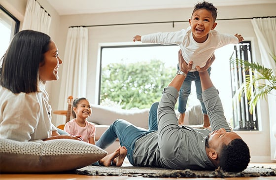 Family playing in living room together