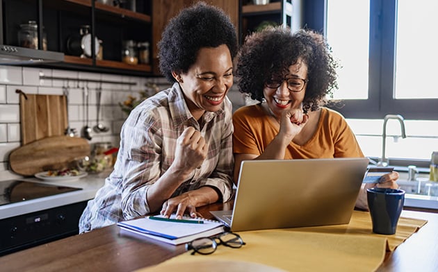 Two women on laptop