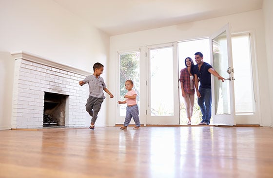 Family entering a new home they purchased 