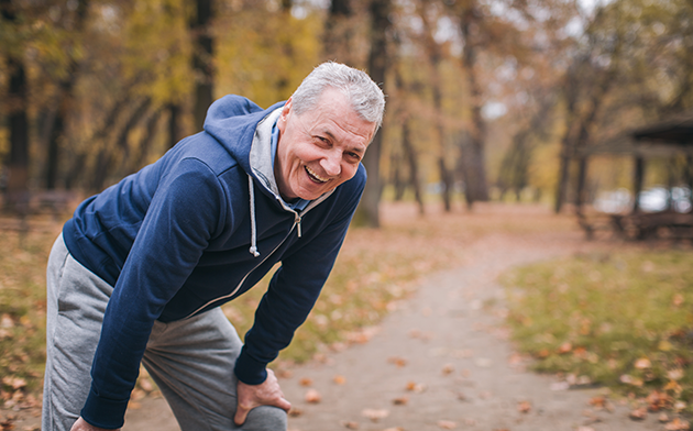 Older man taking a break from running