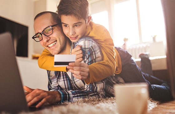 Father teaching son about financial education 