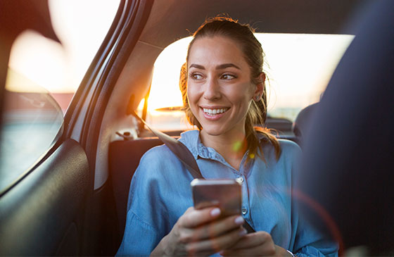 Person looking out window while riding in car