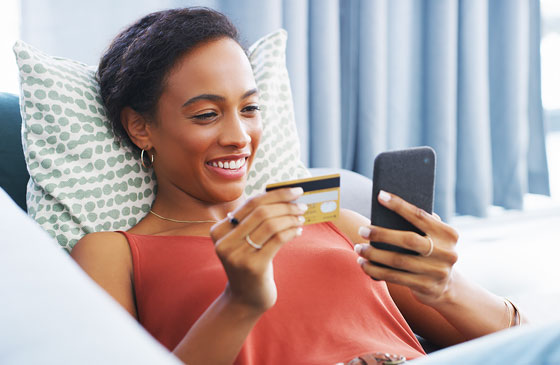 Women using mobile app to update card controls