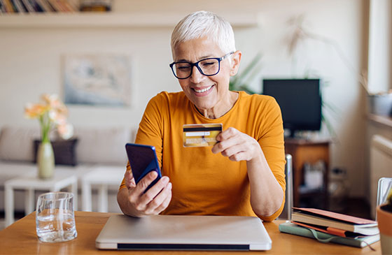Person using credit card to make online purchase