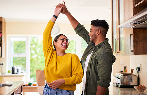Couple dancing in new home
