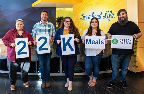 22,000 meals provided sign with SELCO Community Credit Union employees 