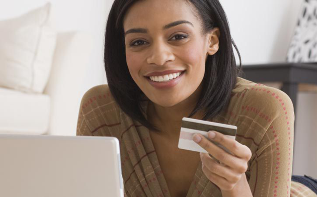 Women Holding Credit Card
